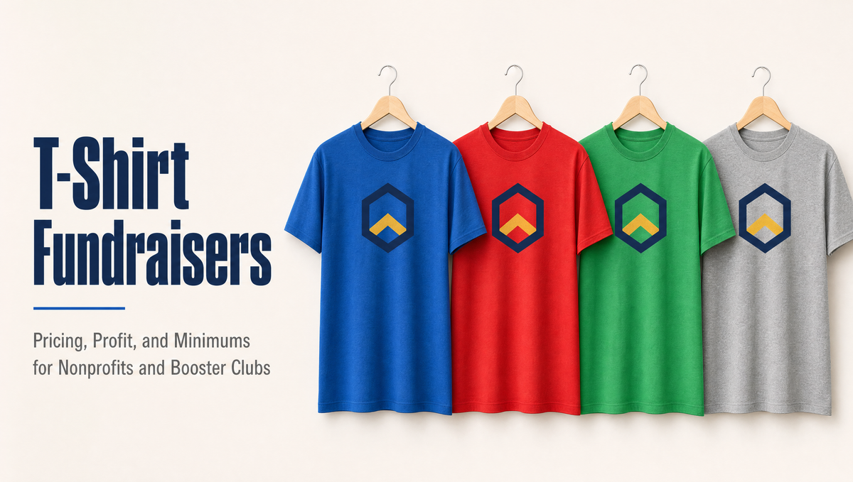 Four fundraiser t-shirts in blue, red, green, and grey hanging with a matching chest emblem
